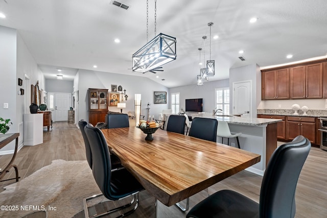 271 Roaring Brook Dr, Saint Augustine, FL 32084 - dining room with lofted ceiling, recessed lighting, and light wood finished floors