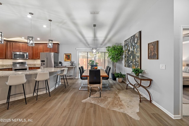 271 Roaring Brook Dr, Saint Augustine, FL 32084 - dining area with light wood-style floors, baseboards, and recessed lighting