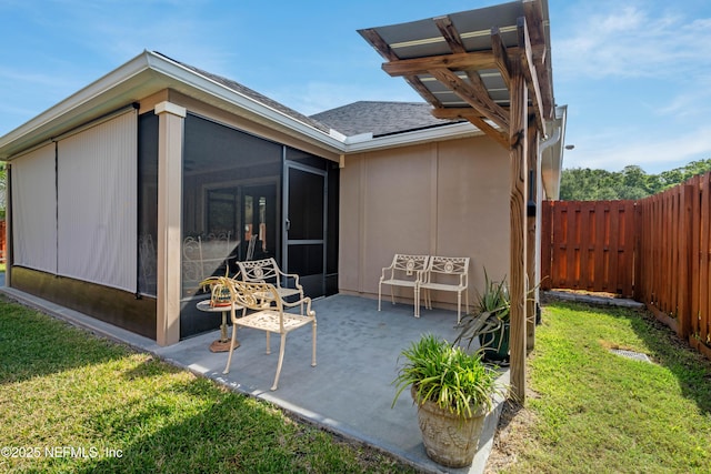 271 Roaring Brook Dr, Saint Augustine, FL 32084 - back of house with a sunroom, a shingled roof, and a patio