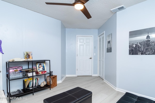 1188 Fromage Way, Jacksonville, FL 32225 - living area with wood finished floors, a ceiling fan, a textured ceiling, and baseboards