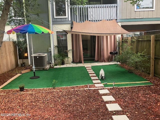 1188 Fromage Way, Jacksonville, FL 32225 - rear view of property featuring central air condition unit, a fenced backyard, and a balcony