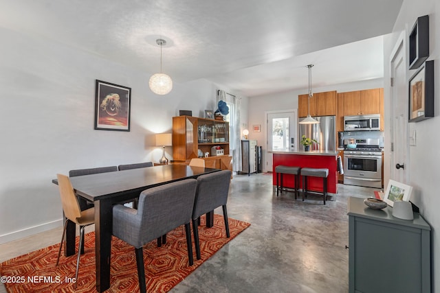 171 Twine St, Saint Augustine, FL 32084 - dining area featuring finished concrete floors and baseboards