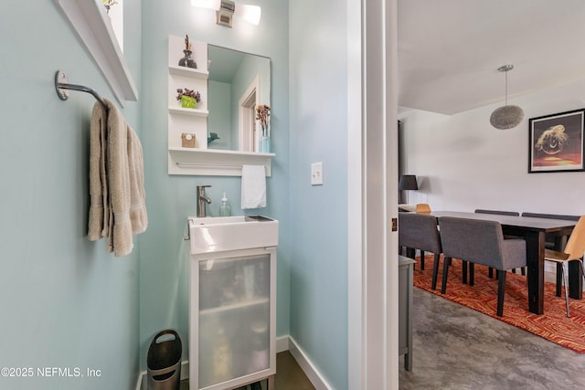 171 Twine St, Saint Augustine, FL 32084 - bathroom featuring finished concrete floors, vanity, and baseboards
