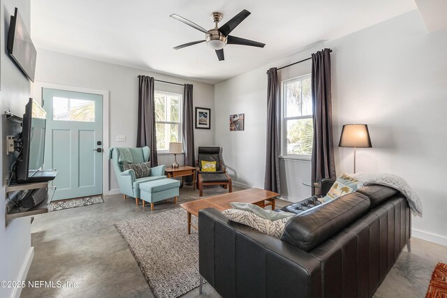 171 Twine St, Saint Augustine, FL 32084 - living area with a ceiling fan, baseboards, and concrete flooring