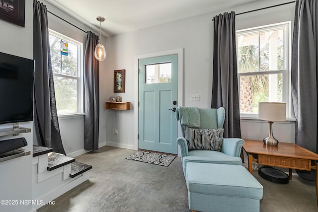 171 Twine St, Saint Augustine, FL 32084 - entrance foyer with concrete flooring, healthy amount of natural light, and baseboards