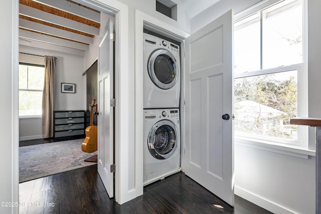 171 Twine St, Saint Augustine, FL 32084 - laundry room with estacked washer and dryer, healthy amount of natural light, baseboards, and dark wood-style floors