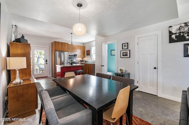 171 Twine St, Saint Augustine, FL 32084 - dining space with baseboards and finished concrete flooring