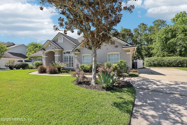232 Shell Bluff Ct, Ponte Vedra Beach, FL 32082 - view of front of property with a front yard, stucco siding, and driveway