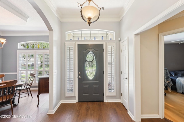 232 Shell Bluff Ct, Ponte Vedra Beach, FL 32082 - entrance foyer with dark wood-style floors, arched walkways, and ornamental molding