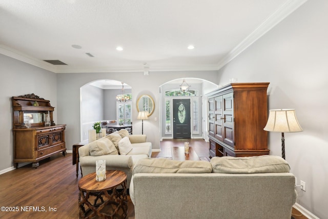 232 Shell Bluff Ct, Ponte Vedra Beach, FL 32082 - living area featuring arched walkways, ornamental molding, dark wood-style floors, a chandelier, and baseboards