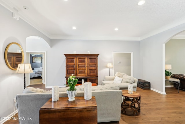 232 Shell Bluff Ct, Ponte Vedra Beach, FL 32082 - living area with arched walkways, wood finished floors, ornamental molding, baseboards, and recessed lighting