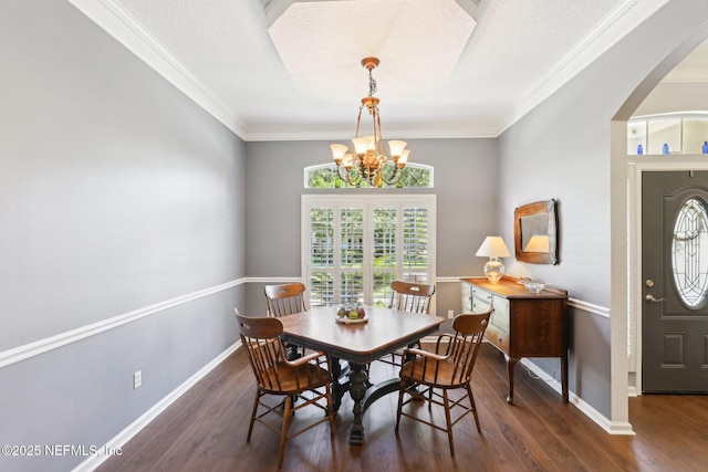232 Shell Bluff Ct, Ponte Vedra Beach, FL 32082 - dining space with a chandelier, arched walkways, ornamental molding, wood finished floors, and baseboards