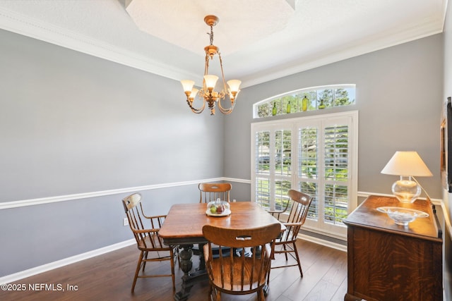 232 Shell Bluff Ct, Ponte Vedra Beach, FL 32082 - dining area featuring healthy amount of natural light, a chandelier, wood finished floors, ornamental molding, and baseboards