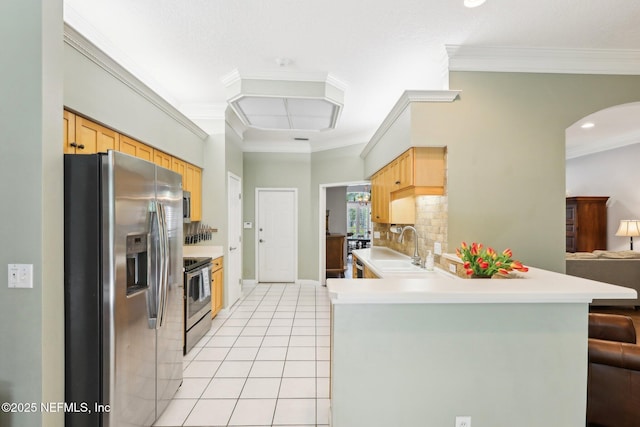 232 Shell Bluff Ct, Ponte Vedra Beach, FL 32082 - kitchen featuring stainless steel appliances, decorative backsplash, arched walkways, light tile patterned floors, and a sink