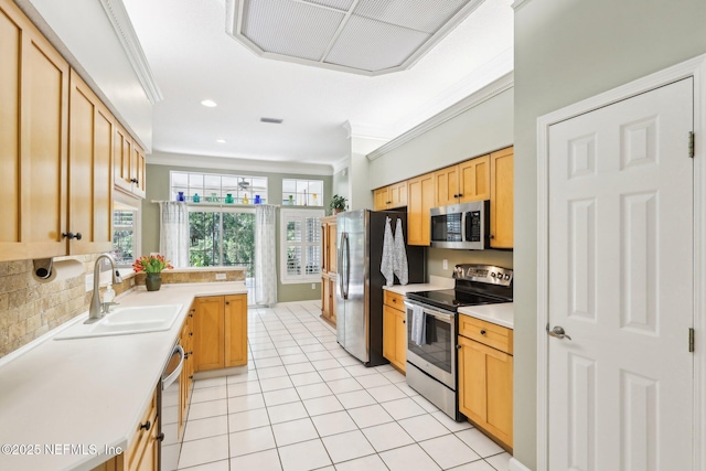 232 Shell Bluff Ct, Ponte Vedra Beach, FL 32082 - kitchen with appliances with stainless steel finishes, a sink, ornamental molding, light countertops, and light tile patterned floors