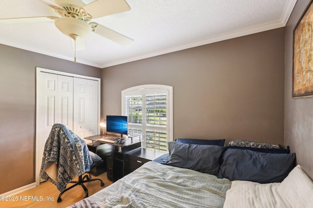 232 Shell Bluff Ct, Ponte Vedra Beach, FL 32082 - bedroom featuring wood finished floors, crown molding, an office area, ceiling fan, and a closet