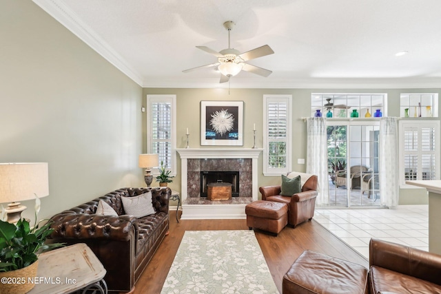 232 Shell Bluff Ct, Ponte Vedra Beach, FL 32082 - living room featuring ceiling fan, a fireplace, ornamental molding, and wood finished floors