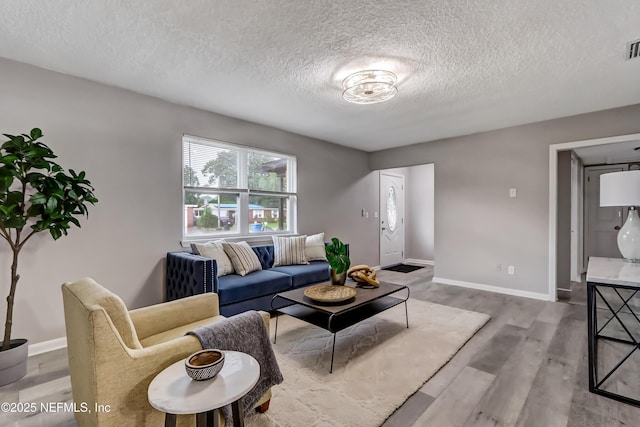 5916 Redberry Ln, Jacksonville, FL 32211 - living room with a textured ceiling and wood finished floors
