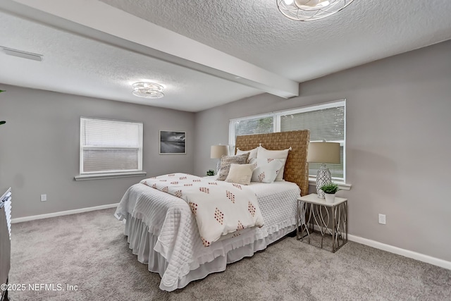 5916 Redberry Ln, Jacksonville, FL 32211 - carpeted bedroom featuring a textured ceiling, multiple windows, and beamed ceiling