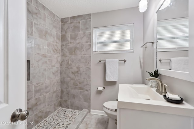 5916 Redberry Ln, Jacksonville, FL 32211 - full bathroom with vanity, a tile shower, and tile patterned floors