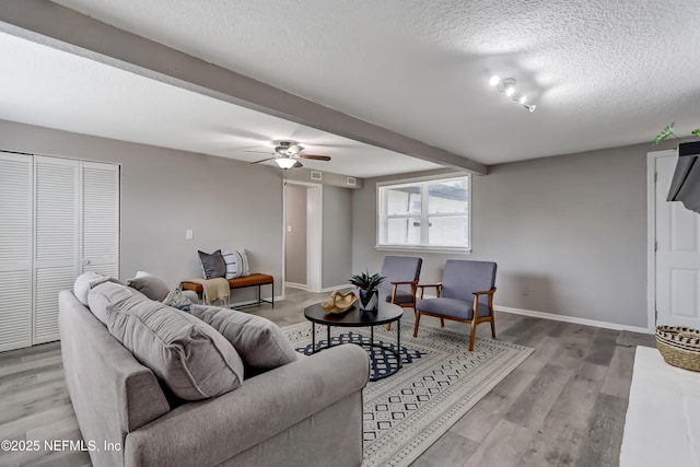 5916 Redberry Ln, Jacksonville, FL 32211 - living area featuring a textured ceiling, wood finished floors, and ceiling fan