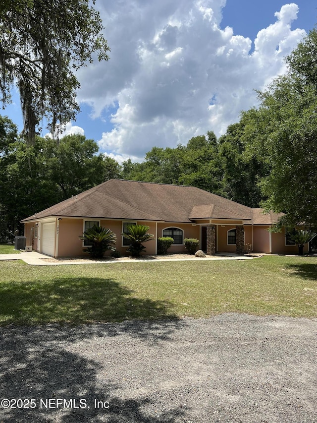 2840 Blackberry Ave, Middleburg, FL 32068 - ranch-style home featuring driveway, an attached garage, a front lawn, and central air condition unit