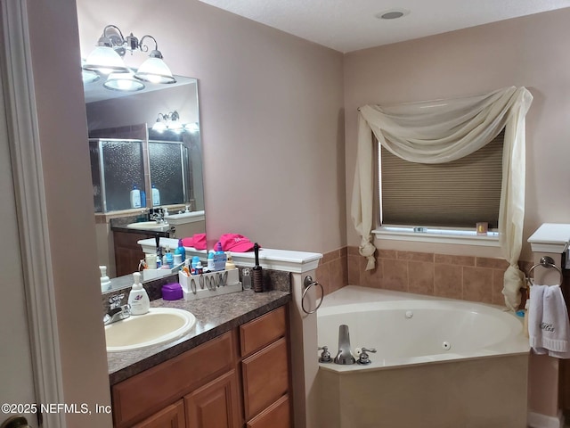 2840 Blackberry Ave, Middleburg, FL 32068 - full bathroom featuring a jetted tub, a shower stall, and vanity