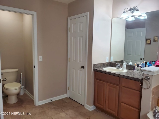 2840 Blackberry Ave, Middleburg, FL 32068 - bathroom featuring vanity, toilet, tile patterned floors, and a chandelier