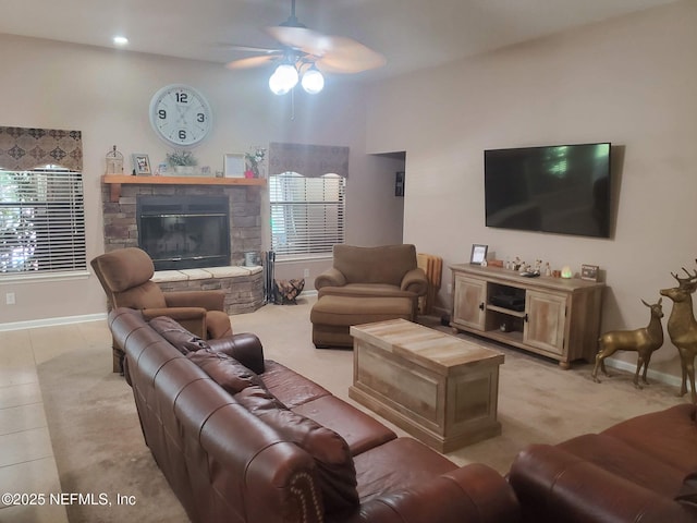 2840 Blackberry Ave, Middleburg, FL 32068 - living area with a ceiling fan, baseboards, healthy amount of natural light, and a stone fireplace