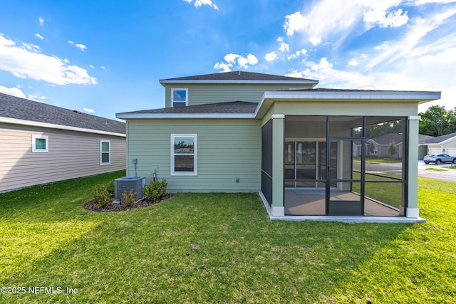 9053 Whinny Way, Jacksonville, FL 32219 - rear view of house featuring a sunroom, a yard, central air condition unit, and a shingled roof