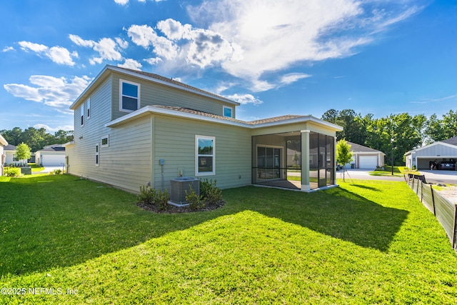 9053 Whinny Way, Jacksonville, FL 32219 - rear view of property featuring cooling unit, a sunroom, a garage, and a yard