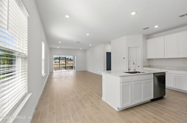 9053 Whinny Way, Jacksonville, FL 32219 - kitchen featuring a sink, dishwasher, recessed lighting, white cabinets, and a kitchen island with sink