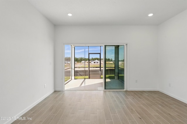 9053 Whinny Way, Jacksonville, FL 32219 - unfurnished room with wood finished floors, baseboards, and recessed lighting