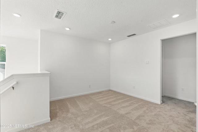 9053 Whinny Way, Jacksonville, FL 32219 - spare room featuring carpet floors, a textured ceiling, recessed lighting, and baseboards