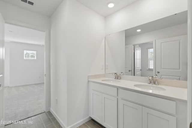 9053 Whinny Way, Jacksonville, FL 32219 - bathroom featuring double vanity, baseboards, and recessed lighting