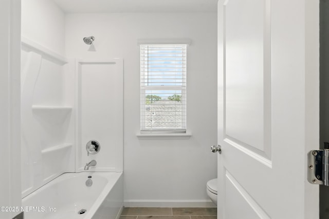 9053 Whinny Way, Jacksonville, FL 32219 - bathroom with baseboards, bathing tub / shower combination, and toilet