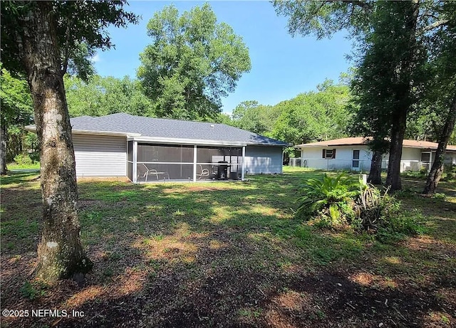 4001 S Linwood Ter, Inverness, FL 34452 - view of grassy yard with a sunroom