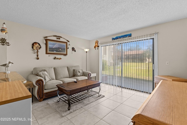 1255 Ponce Island Dr Unit F-779, Saint Augustine, FL 32084 - living room featuring light tile patterned floors and a textured ceiling