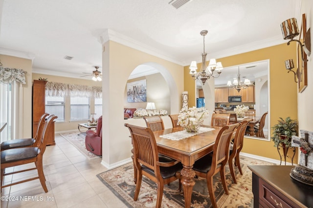 5346 Brighton Park Ln, Jacksonville, FL 32210 - dining space with arched walkways, a chandelier, crown molding, light tile patterned floors, and ceiling fan