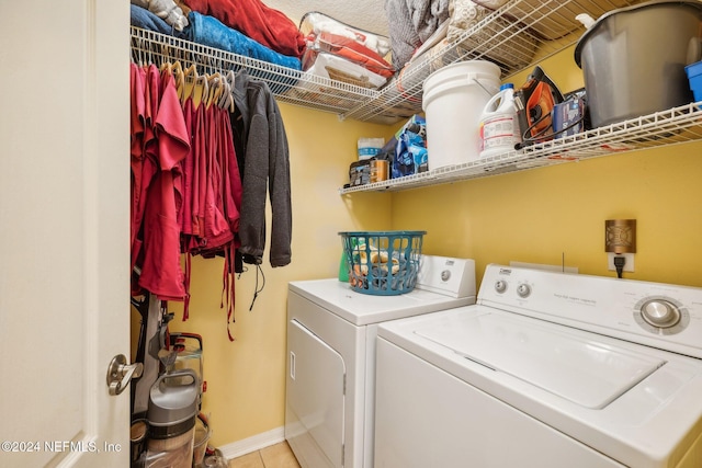 5346 Brighton Park Ln, Jacksonville, FL 32210 - washroom featuring washer and dryer, light tile patterned flooring, and baseboards