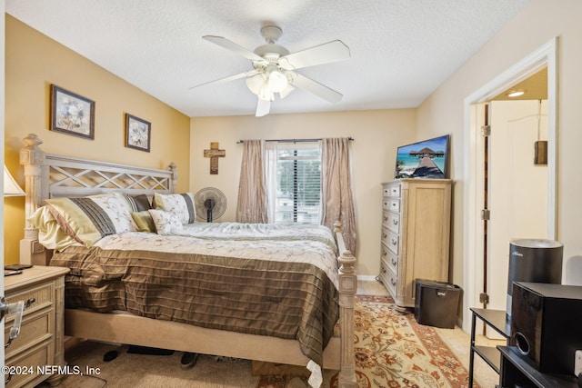 5346 Brighton Park Ln, Jacksonville, FL 32210 - bedroom featuring a textured ceiling, light colored carpet, and ceiling fan
