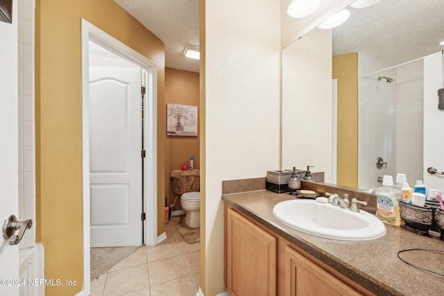 5346 Brighton Park Ln, Jacksonville, FL 32210 - full bath with toilet, vanity, a textured ceiling, tile patterned flooring, and a shower