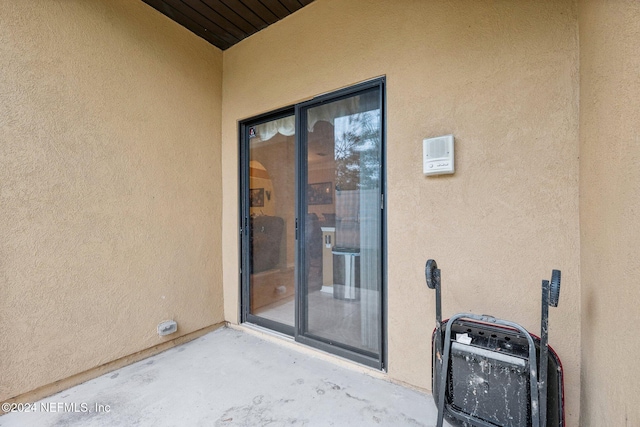 5346 Brighton Park Ln, Jacksonville, FL 32210 - property entrance with stucco siding
