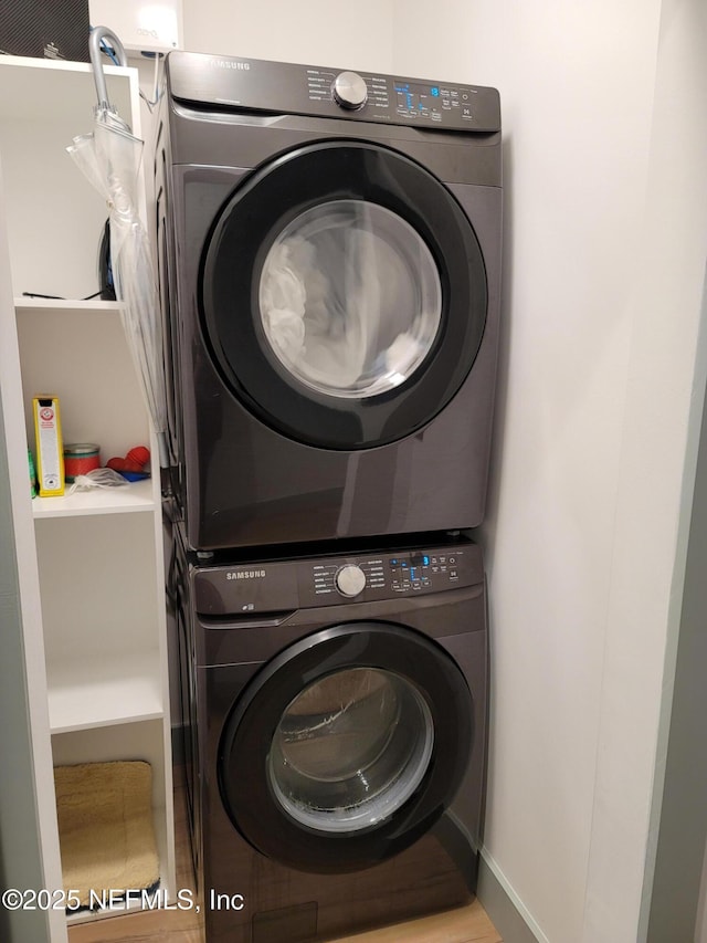 66 Oneida St, Saint Augustine, FL 32084 - washroom with stacked washing machine and dryer and baseboards