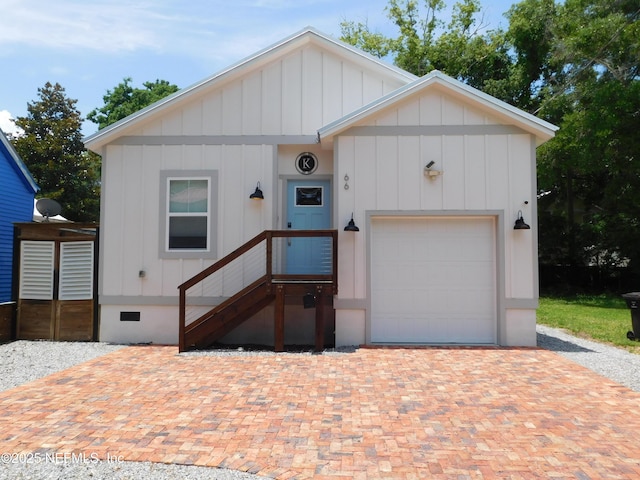 66 Oneida St, Saint Augustine, FL 32084 - view of front of house with board and batten siding, crawl space, and a garage
