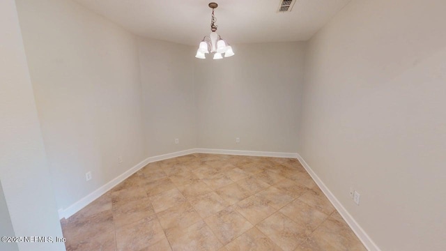 4480 Deerwood Lake Pkwy Unit 633, Jacksonville, FL 32216 - empty room featuring a chandelier and baseboards
