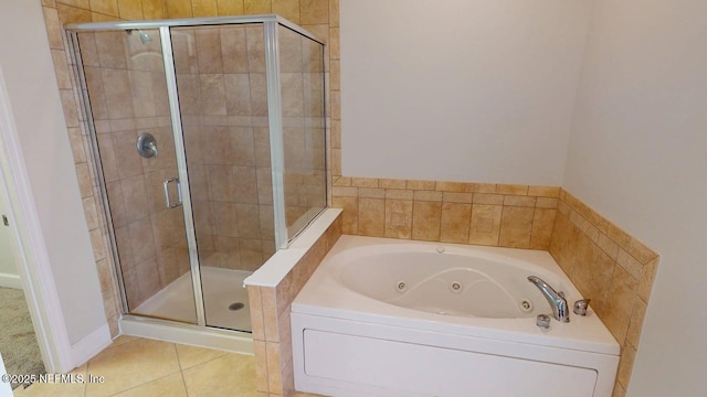 4480 Deerwood Lake Pkwy Unit 633, Jacksonville, FL 32216 - full bathroom featuring a shower stall, a tub with jets, and tile patterned flooring