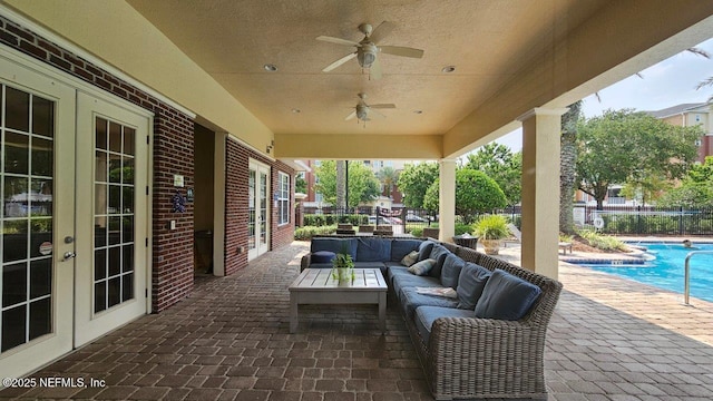 4480 Deerwood Lake Pkwy Unit 633, Jacksonville, FL 32216 - view of patio / terrace with french doors, an outdoor hangout area, a community pool, and ceiling fan