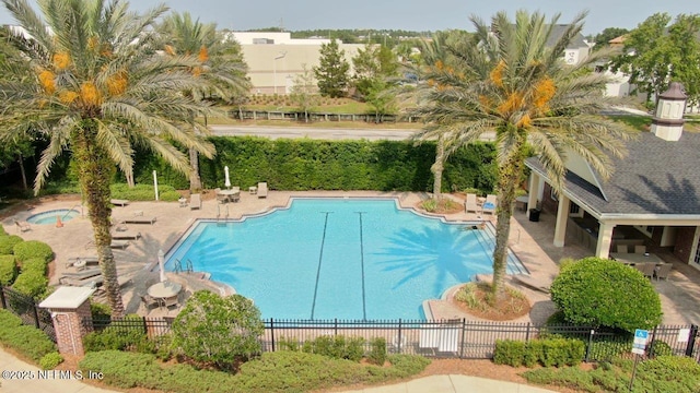 4480 Deerwood Lake Pkwy Unit 633, Jacksonville, FL 32216 - community pool featuring a patio area