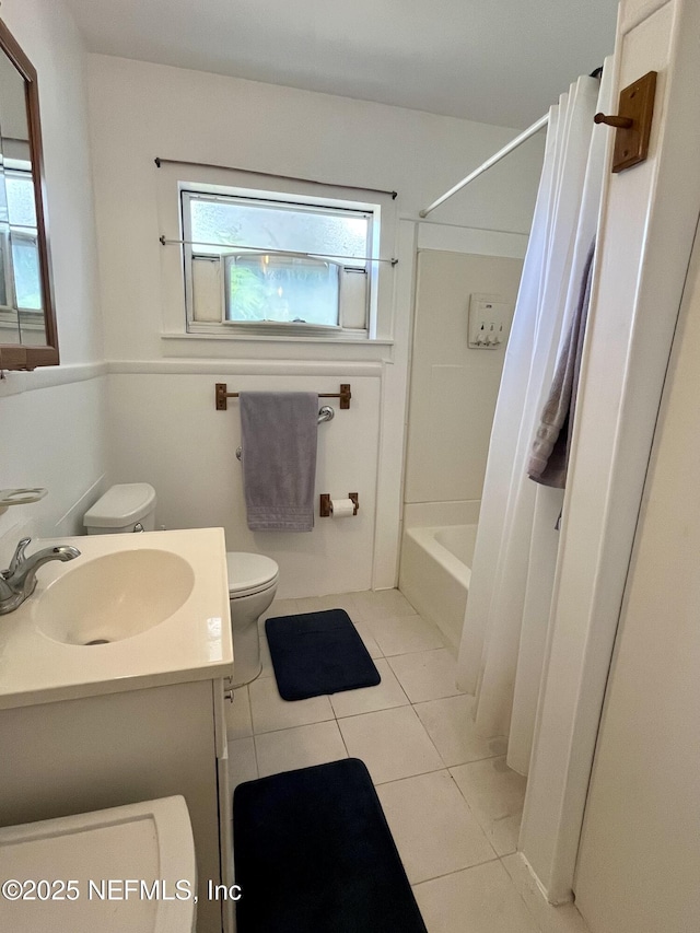5000 Elm St, Welaka, FL 32189 - bathroom featuring toilet, tile patterned floors, vanity, and shower / tub combo